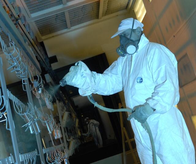 Manual sprayingwith KMX electrostatic airmix spraygun Manual sprayingwith KMX electrostatic airmix spraygun